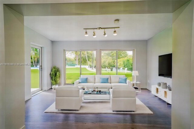 8390 SW 64th St, Miami, FL 33143 - living area with healthy amount of natural light, wood finished floors, and track lighting