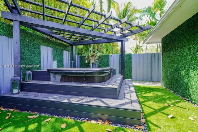 8390 SW 64th St, Miami, FL 33143 - view of yard with a covered hot tub, a wooden deck, and a pergola