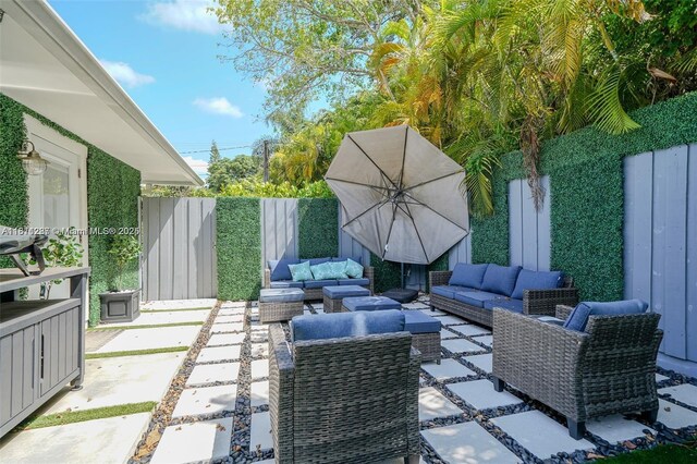 8390 SW 64th St, Miami, FL 33143 - fenced backyard with outdoor lounge area and a patio