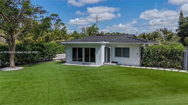 8390 SW 64th St, Miami, FL 33143 - rear view of house with a yard and stucco siding