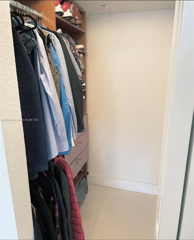 445 SW 11th St Unit 101, Miami, FL 33130 - walk in closet with tile patterned flooring