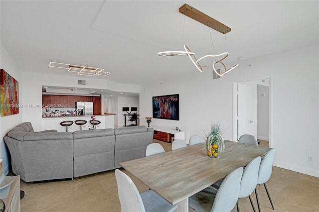 14951 Royal Oaks Ln Unit 803, North Miami, FL 33181 - dining area featuring a chandelier