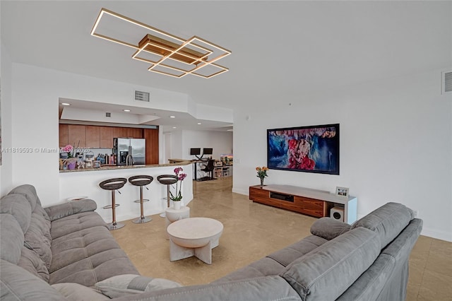 14951 Royal Oaks Ln Unit 803, North Miami, FL 33181 - living area featuring light tile patterned floors, recessed lighting, and a chandelier