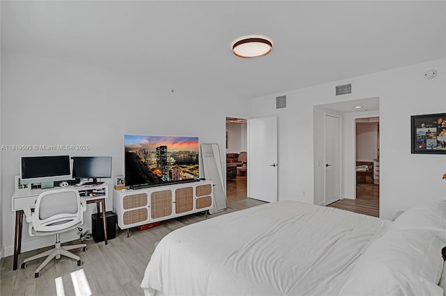 14951 Royal Oaks Ln Unit 803, North Miami, FL 33181 - bedroom with wood finished floors and a desk