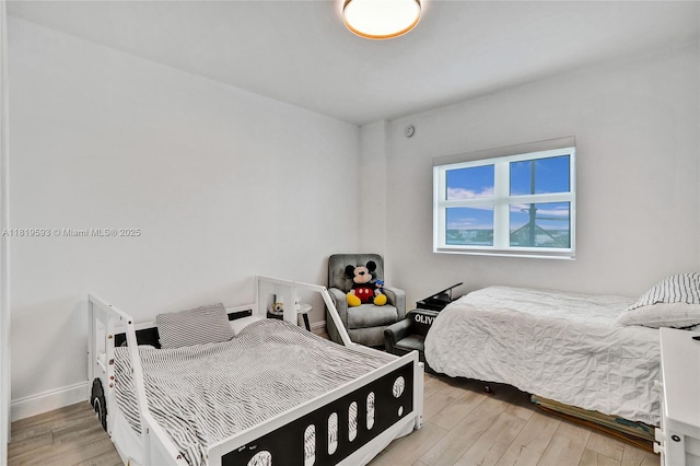14951 Royal Oaks Ln Unit 803, North Miami, FL 33181 - bedroom featuring light wood-style floors and baseboards