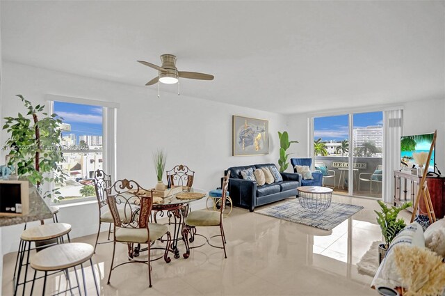 7118 Bonita Dr Unit 405, Miami Beach, FL 33141 - tiled living area with healthy amount of natural light, a ceiling fan, and a view of city