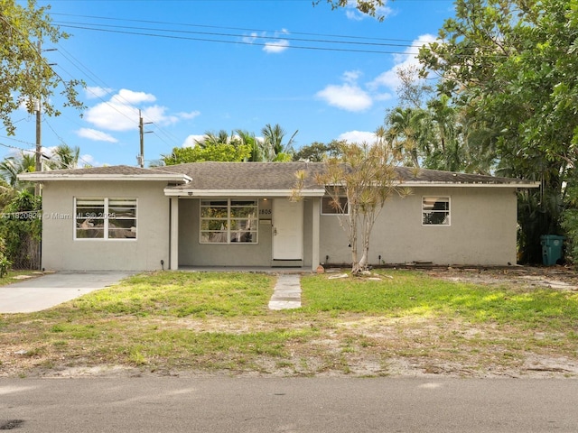 1805 N 23rd Ave, Hollywood, FL 33020 - ranch-style home featuring stucco siding, a front lawn, and roof with shingles