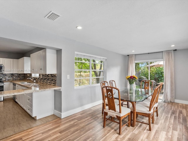 1805 N 23rd Ave, Hollywood, FL 33020 - dining area featuring light wood-style floors and recessed lighting