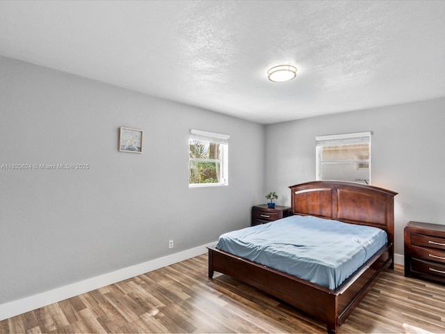 1805 N 23rd Ave, Hollywood, FL 33020 - bedroom featuring wood finished floors and a textured ceiling