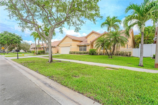 16176 NW 14th Ct, Pembroke Pines, FL 33028 - view of front of home with stucco siding, an attached garage, driveway, and a tiled roof