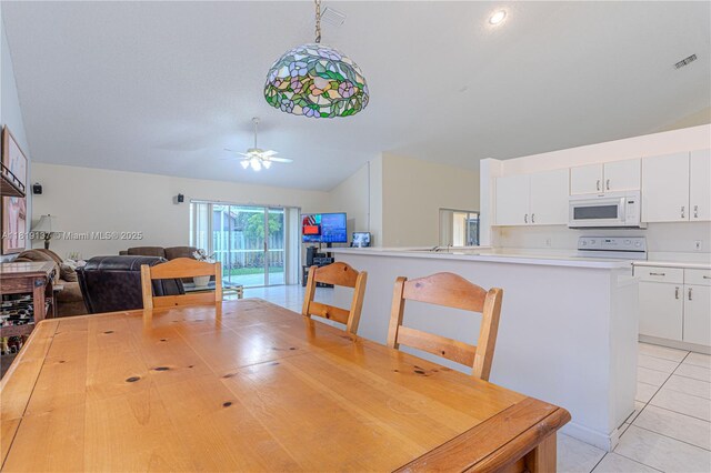 16176 NW 14th Ct, Pembroke Pines, FL 33028 - dining space featuring vaulted ceiling, light tile patterned floors, and a ceiling fan