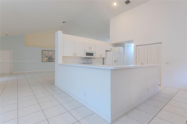 16176 NW 14th Ct, Pembroke Pines, FL 33028 - kitchen featuring white appliances, high vaulted ceiling, light tile patterned floors, light countertops, and a peninsula
