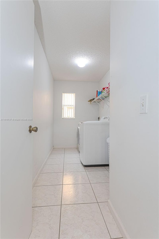 16176 NW 14th Ct, Pembroke Pines, FL 33028 - laundry room featuring separate washer and dryer and a textured ceiling