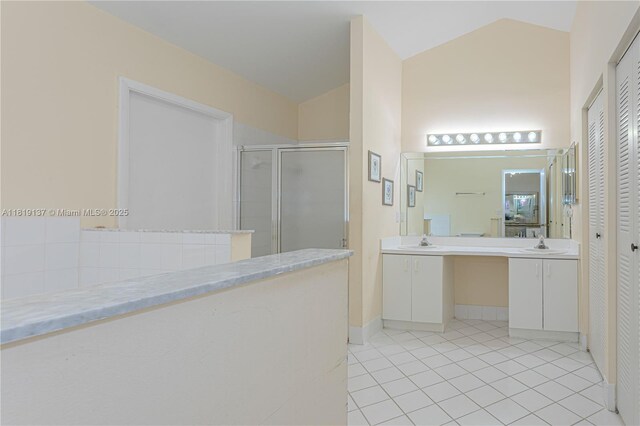 16176 NW 14th Ct, Pembroke Pines, FL 33028 - full bathroom with a stall shower, vanity, vaulted ceiling, tile patterned flooring, and a closet