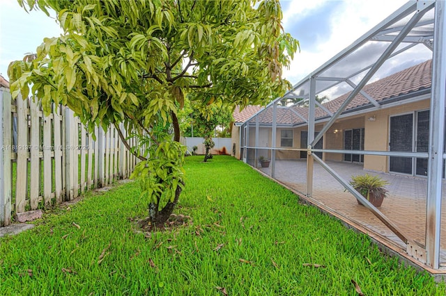 16176 NW 14th Ct, Pembroke Pines, FL 33028 - fenced backyard with glass enclosure and a patio area