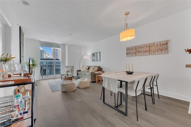 1250 S Miami Ave Unit 2210, Miami, FL 33130 - dining area featuring wood finished floors and floor to ceiling windows