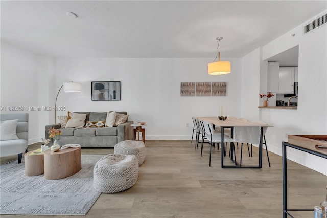 1250 S Miami Ave Unit 2210, Miami, FL 33130 - living area featuring light wood-style floors and baseboards