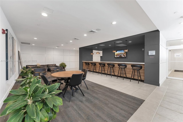 1250 S Miami Ave Unit 2210, Miami, FL 33130 - tiled dining area with a bar and recessed lighting