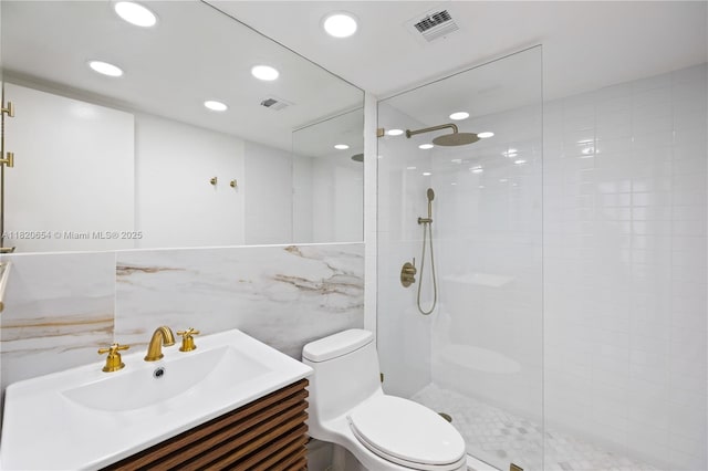 1440 Brickell Bay Unit 307, Miami, FL 33131 - full bath featuring vanity, walk in shower, recessed lighting, and tile walls