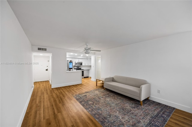 1440 Brickell Bay Unit 307, Miami, FL 33131 - living room with light wood finished floors, a ceiling fan, and recessed lighting