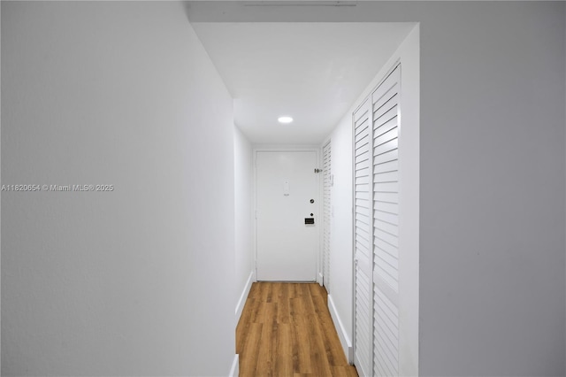 1440 Brickell Bay Unit 307, Miami, FL 33131 - corridor with wood finished floors and recessed lighting