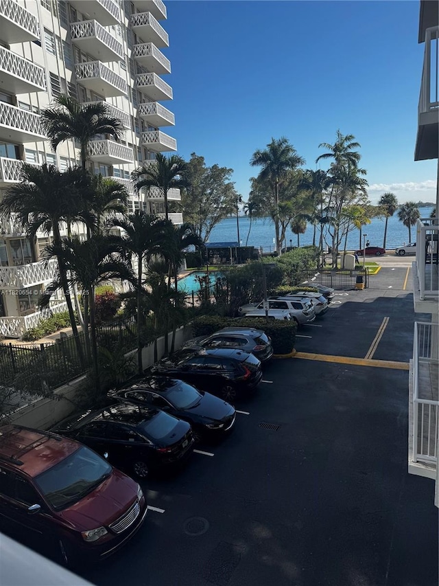 1440 Brickell Bay Unit 307, Miami, FL 33131 - uncovered parking lot featuring a water view