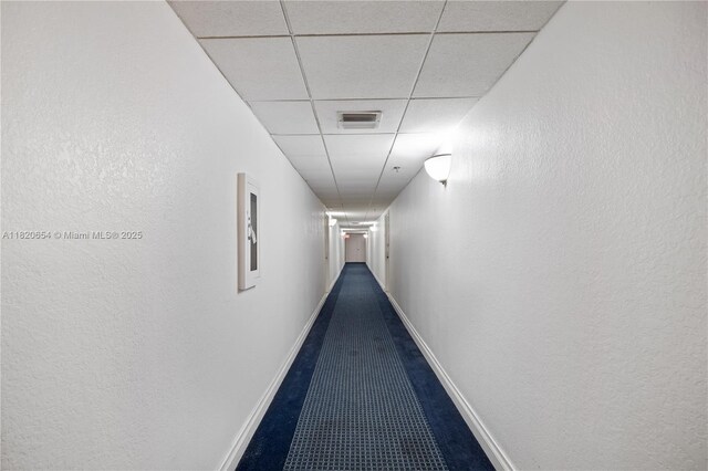 1440 Brickell Bay Unit 307, Miami, FL 33131 - hall featuring a drop ceiling and a textured wall