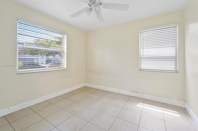 602 El Prado, West Palm Beach, FL 33405 - empty room with light tile patterned floors and a ceiling fan