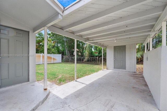 602 El Prado, West Palm Beach, FL 33405 - fenced backyard featuring a patio and a carport