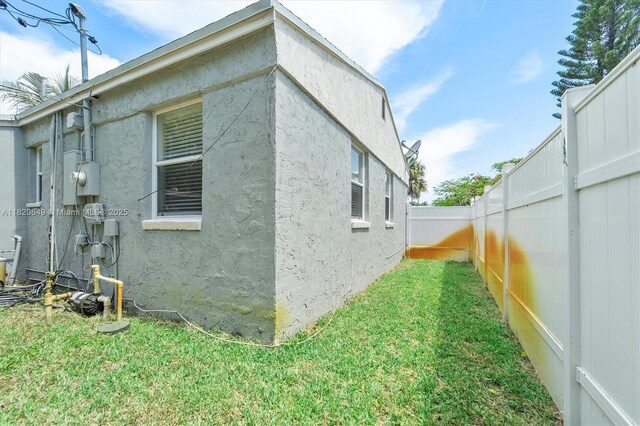 602 El Prado, West Palm Beach, FL 33405 - view of property exterior featuring a fenced backyard and stucco siding