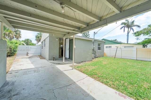 602 El Prado, West Palm Beach, FL 33405 - rear view of property with a patio area and stucco siding