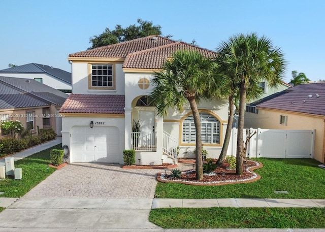 15872 NW 21st St, Pembroke Pines, FL 33028 - mediterranean / spanish house featuring a tile roof, stucco siding, driveway, and a garage