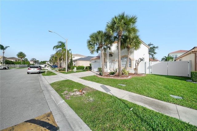 15872 NW 21st St, Pembroke Pines, FL 33028 - view of front facade with a gate and a residential view