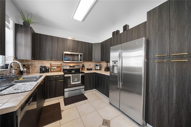 15872 NW 21st St, Pembroke Pines, FL 33028 - kitchen with appliances with stainless steel finishes, backsplash, light tile patterned floors, modern cabinets, and dark brown cabinets