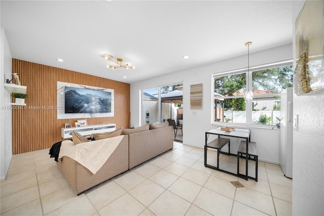 15872 NW 21st St, Pembroke Pines, FL 33028 - living area featuring an accent wall, wooden walls, recessed lighting, light tile patterned floors, and a chandelier