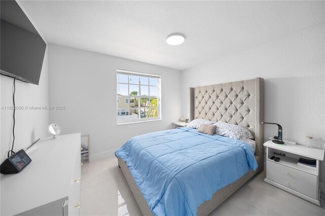 15872 NW 21st St, Pembroke Pines, FL 33028 - bedroom with tile patterned flooring and a textured ceiling