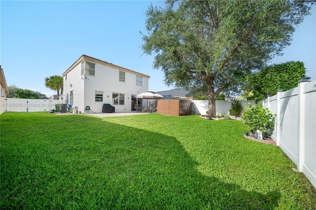 15872 NW 21st St, Pembroke Pines, FL 33028 - back of property with a fenced backyard, stucco siding, and a patio