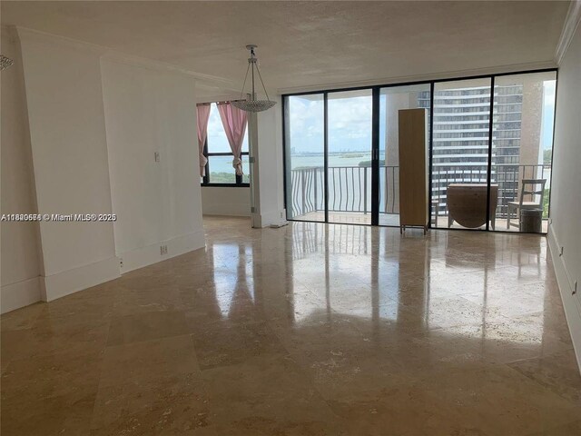 780 NE 69th St Unit 1507, Miami, FL 33138 - empty room featuring baseboards and a water view
