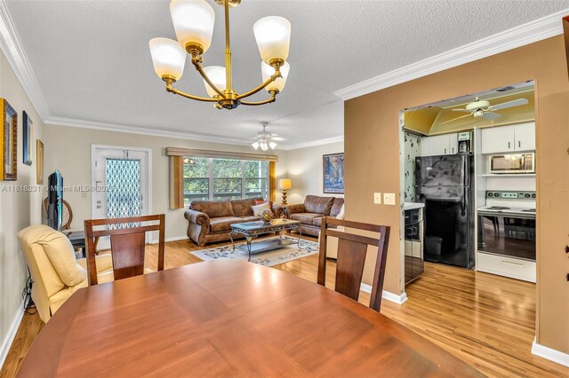 2026 Berkshire B 2026, Deerfield Beach, FL 33442 - dining space with a chandelier, crown molding, light wood-type flooring, ceiling fan, and a textured ceiling