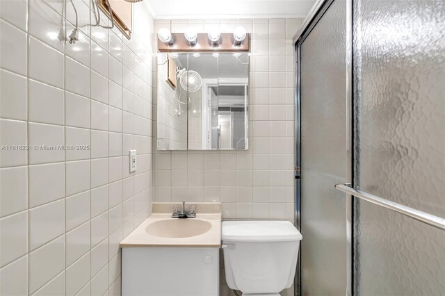 2026 Berkshire B 2026, Deerfield Beach, FL 33442 - bathroom featuring tile walls, vanity, a shower with door, and tasteful backsplash