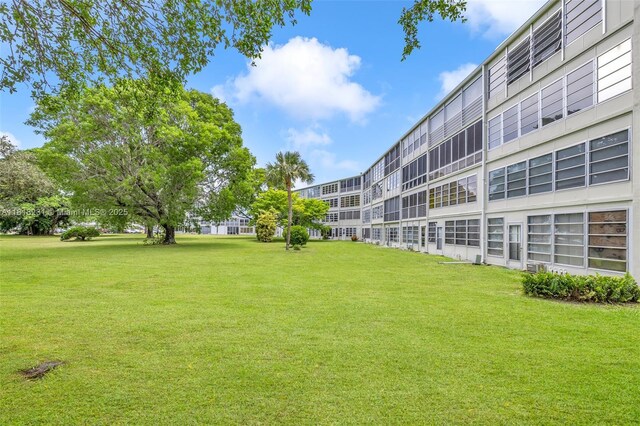 2026 Berkshire B 2026, Deerfield Beach, FL 33442 - view of community featuring a lawn