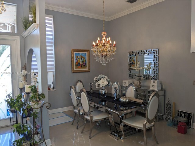 1496 NW 127th Way, Coral Springs, FL 33071 - dining room featuring plenty of natural light, a chandelier, crown molding, and arched walkways