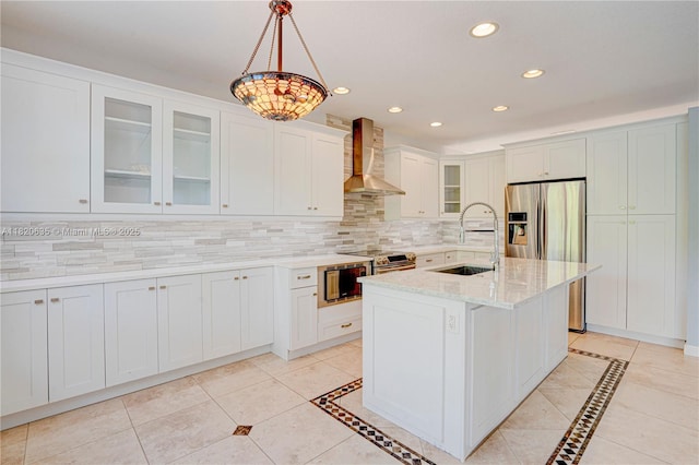 4801 SW 158th Ave, Miramar, FL 33027 - kitchen with wall chimney range hood, appliances with stainless steel finishes, recessed lighting, backsplash, and glass insert cabinets