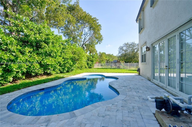 4801 SW 158th Ave, Miramar, FL 33027 - view of swimming pool with french doors and a patio area