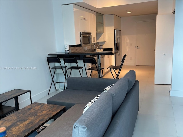 60 SW 13th St Unit 2606, Miami, FL 33130 - living area with baseboards and light tile patterned floors