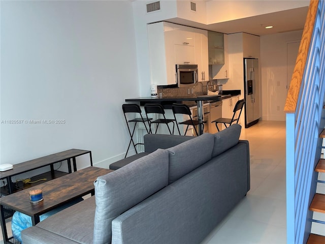 60 SW 13th St Unit 2606, Miami, FL 33130 - living room featuring baseboards