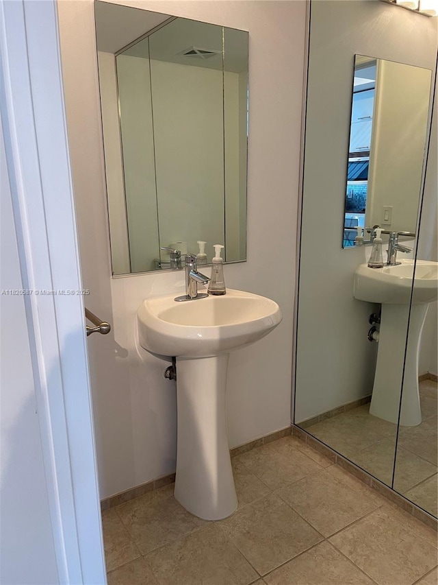 60 SW 13th St Unit 2606, Miami, FL 33130 - bathroom with tile patterned flooring and baseboards