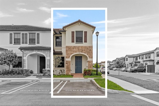 3411 W 112th Ter, Hialeah, FL 33018 - view of front of house with stone siding, uncovered parking, stucco siding, and a residential view