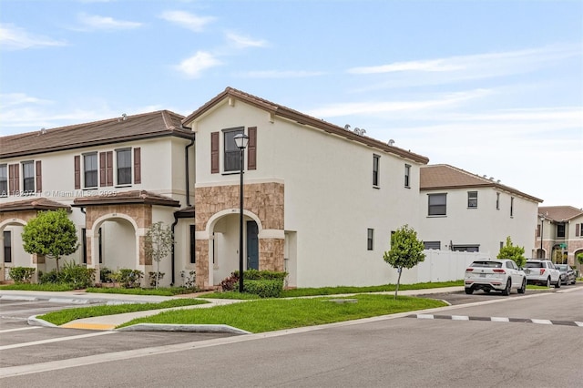 3411 W 112th Ter, Hialeah, FL 33018 - view of front of house featuring stone siding and stucco siding