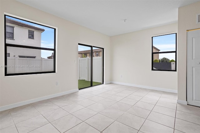 3411 W 112th Ter, Hialeah, FL 33018 - unfurnished room featuring light tile patterned floors and baseboards
